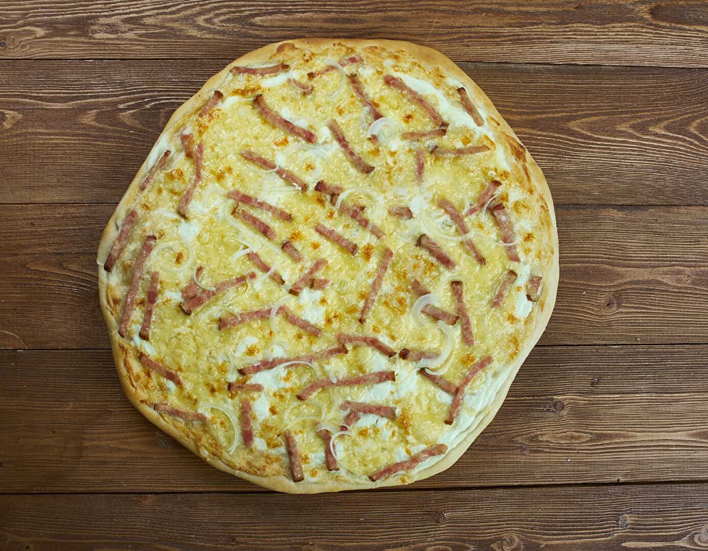 Flammekueche : Rentrez dans l'histoire de la célèbre Tarte Flambée Alsacienne