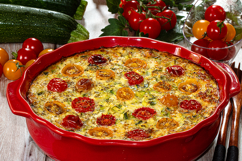 Clafoutis aux tomates cerises, courgettes et fromage de chèvre frais