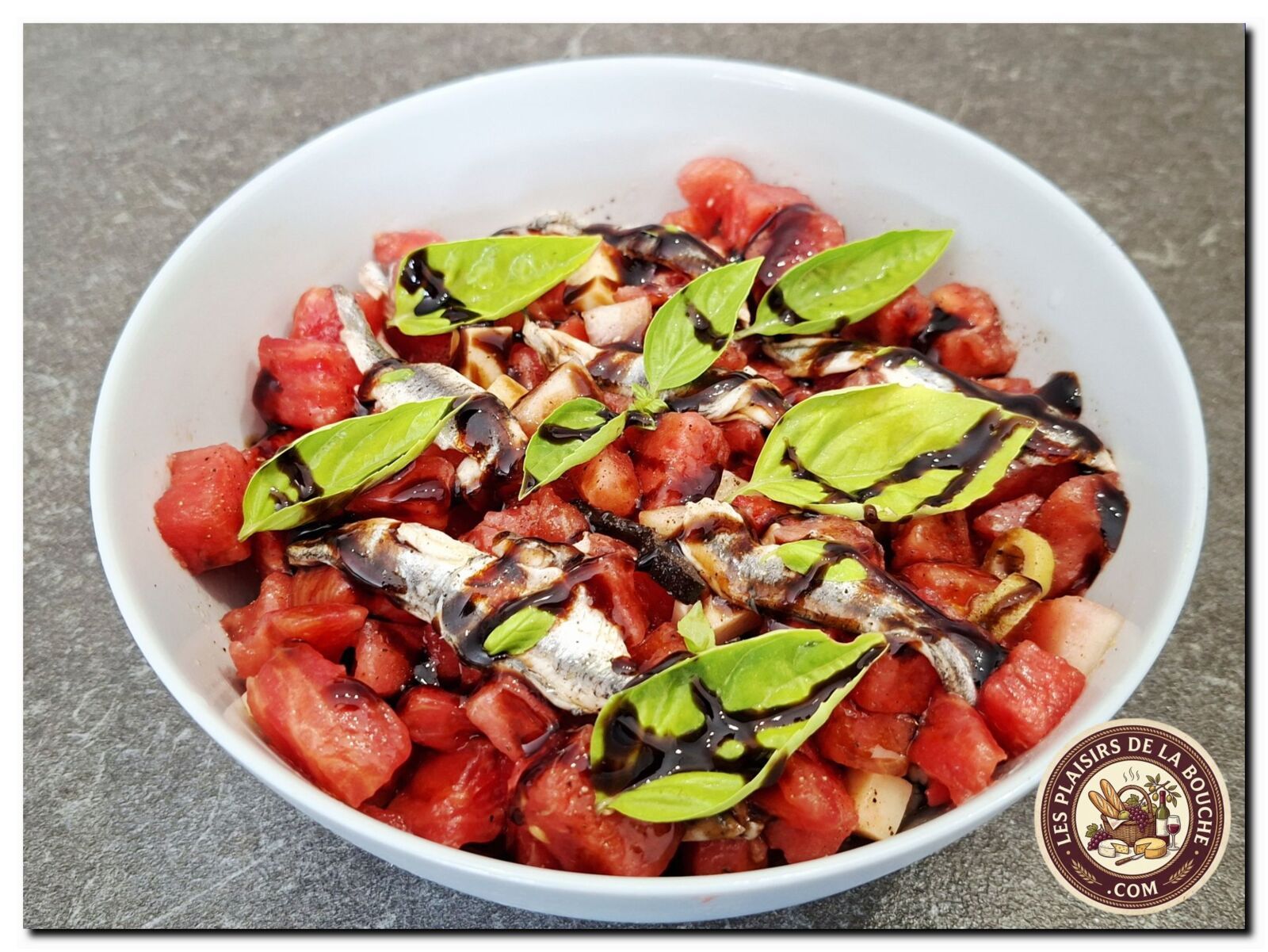 Salade tomate, pastèque, anchois et conté