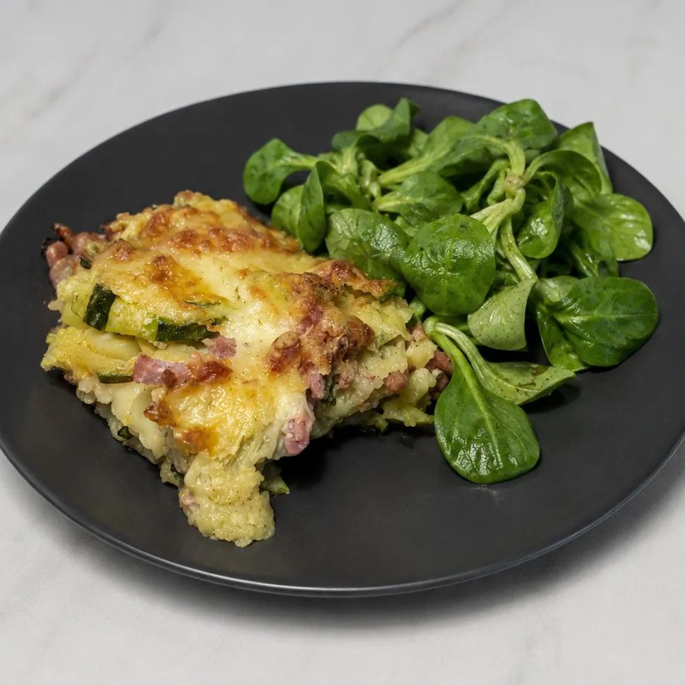 Gratin de ravioles du Dauphiné au jambon fumé et courgettes