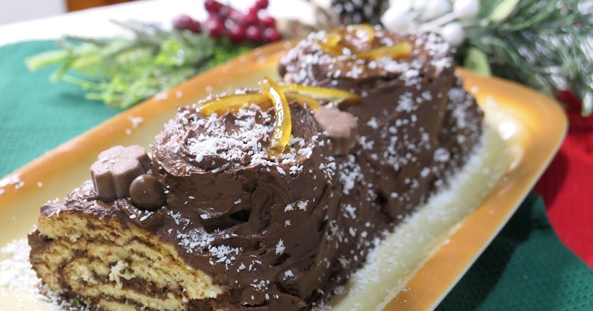 GÉNOISE ROULÉE GANACHE AUX DEUX CHOCOLATS- MIEL- NOIX DE CAJOU ET MARMELADE D'ORANGE FAÇON BÛCHE